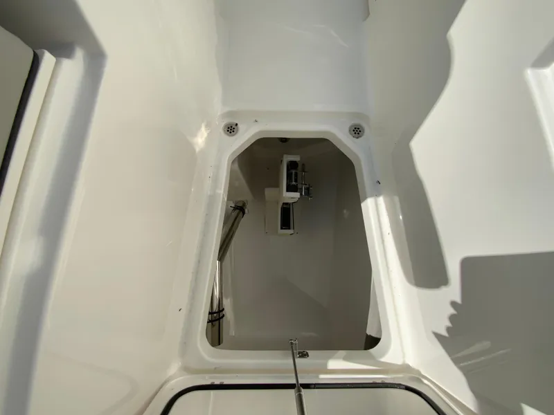 Slide: The Image of 2025 Pursuit DC 306 Dual Console storage compartment interior. - 36