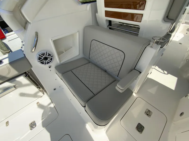 Slide: The Image of 2025 Pursuit DC 306 Dual Console boat interior seating area. - 41