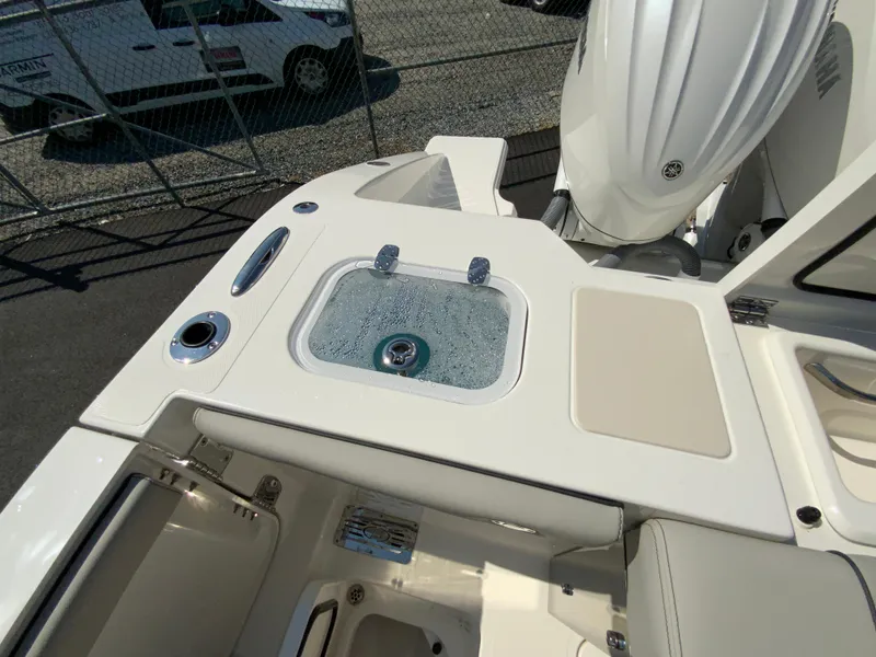 Slide: The Image of 2025 Pursuit DC 306 Dual Console boat with livewell and storage compartments. - 47