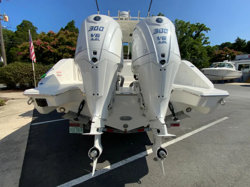 Slide: The Image of 2025 Pursuit DC 306 Dual Console with twin 300 V6 engines, rear view. - 9