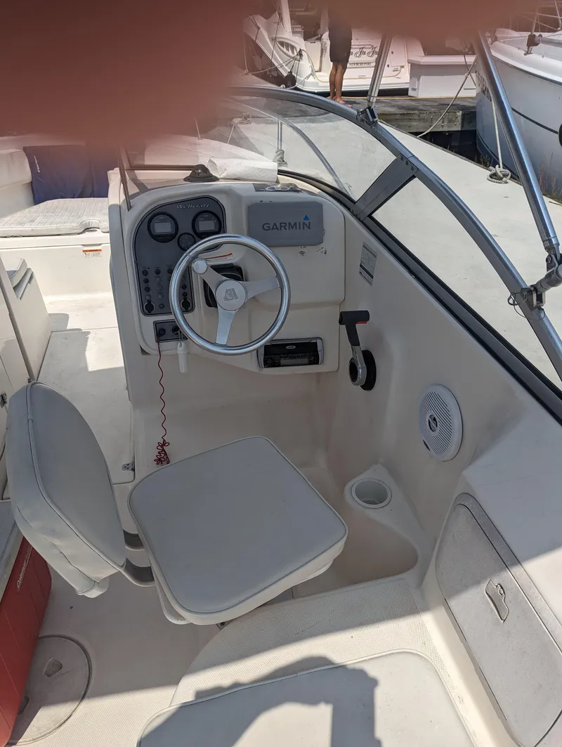 Slide: The Image of 2004 Wellcraft 220 Sportsman DC boat cockpit with Garmin navigation system. - 3