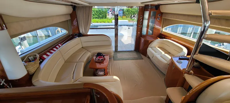 Slide: The Image of Luxurious interior of a 2006 Viking Sport Cruisers 61 Flybridge yacht with plush seating. - 12