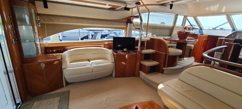 Slide: The Image of Luxurious interior of 2006 Viking Sport Cruisers 61 Flybridge yacht with elegant seating and modern amenities. - 13