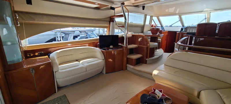 Slide: The Image of Luxurious interior of 2006 Viking Sport Cruisers 61 Flybridge yacht with plush seating and elegant wood finishes. - 2