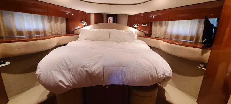 Slide: The Image of Luxurious bedroom in 2006 Viking Sport Cruisers 61 Flybridge yacht with plush bedding. - 3
