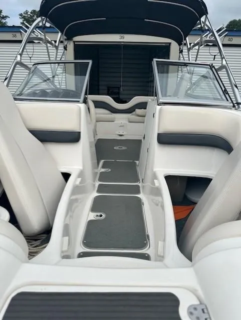 Slide: The Image of 2007 Yamaha Boats AR 210 interior view with seating and storage compartments. - 6