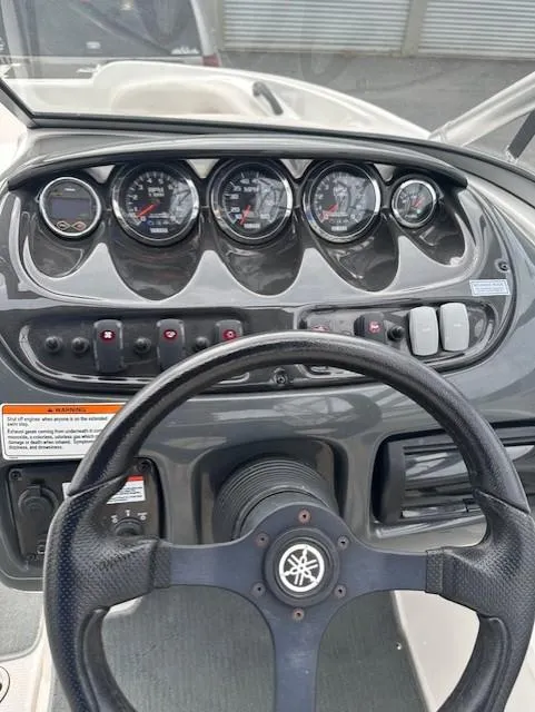 Slide: The Image of 2007 Yamaha Boats AR 210 dashboard with gauges and steering wheel. - 8