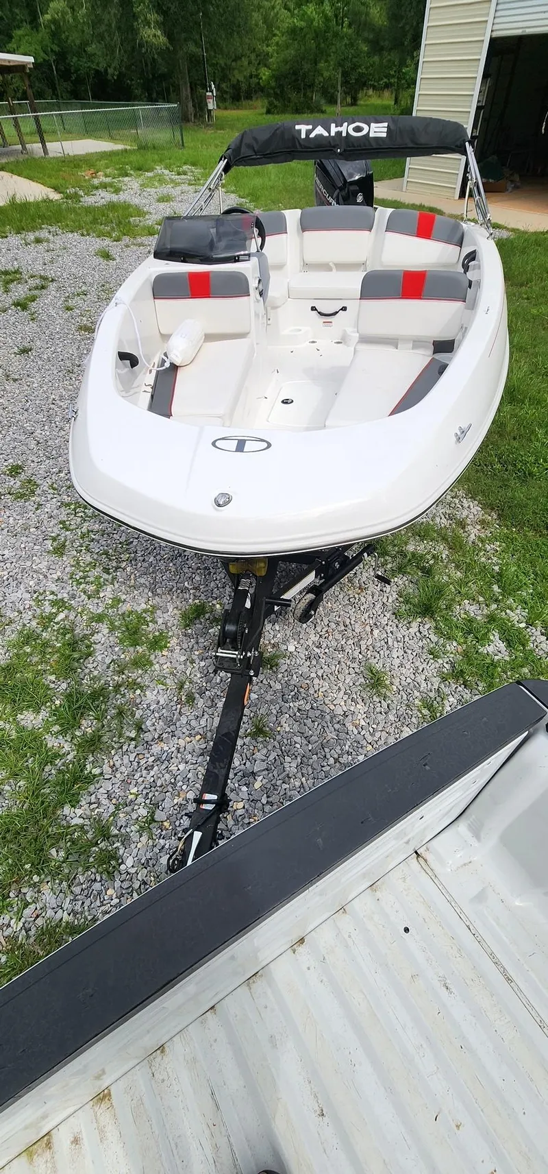 Slide: The Image of 2023 Tahoe T16 boat on trailer, white with red and black seating. - 3