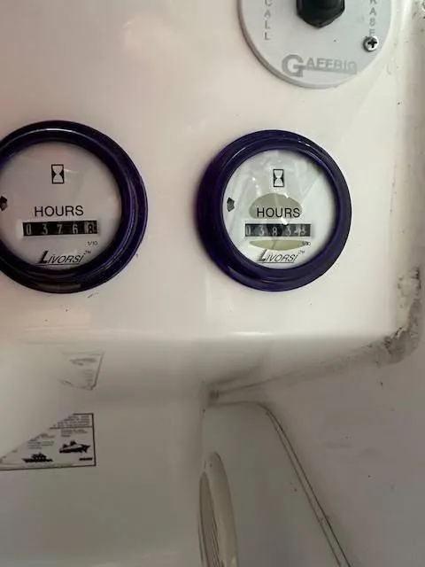 Slide: The Image of 2004 Powerquest 340 Vyper hour meters showing 376.8 and 184.5 hours. - 10