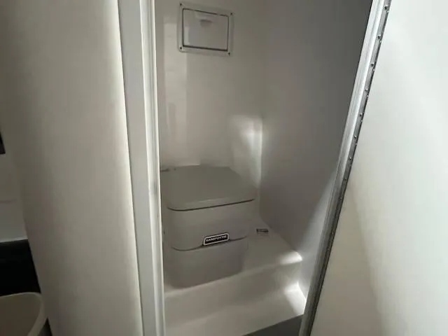 Slide: The Image of Compact bathroom in 2004 Powerquest 340 Vyper boat. - 18