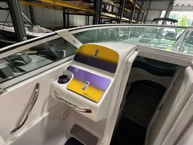 Slide: The Image of 2004 Powerquest 340 Vyper boat interior with purple and yellow accents. - 19