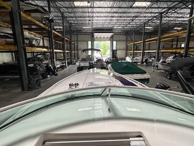 Slide: The Image of 2004 Powerquest 340 Vyper in a boat storage facility. - 20