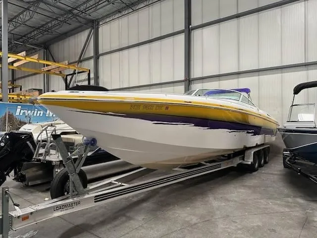 Slide: The Image of 2004 Powerquest 340 Vyper boat on Loadmaster trailer in indoor storage. - 4