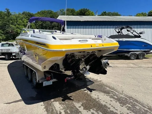 Slide: The Image of 2004 Powerquest 340 Vyper boat on trailer, rear view, yellow and white. - 5