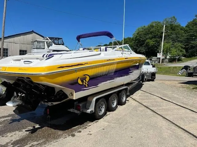 Slide: The Image of 2004 Powerquest 340 Vyper boat on a trailer, yellow and purple design. - 7