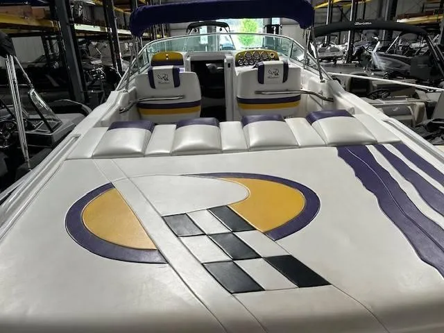 Slide: The Image of 2004 Powerquest 340 Vyper boat interior with custom upholstery and dashboard. - 8