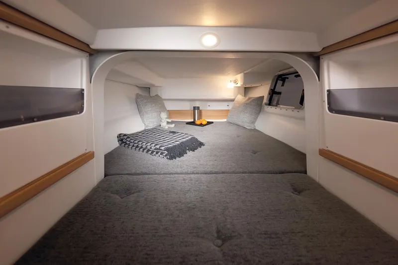 Slide: The Image of Cozy interior of 2026 Dragonfly 28 sailboat with cushions and blanket. - 12