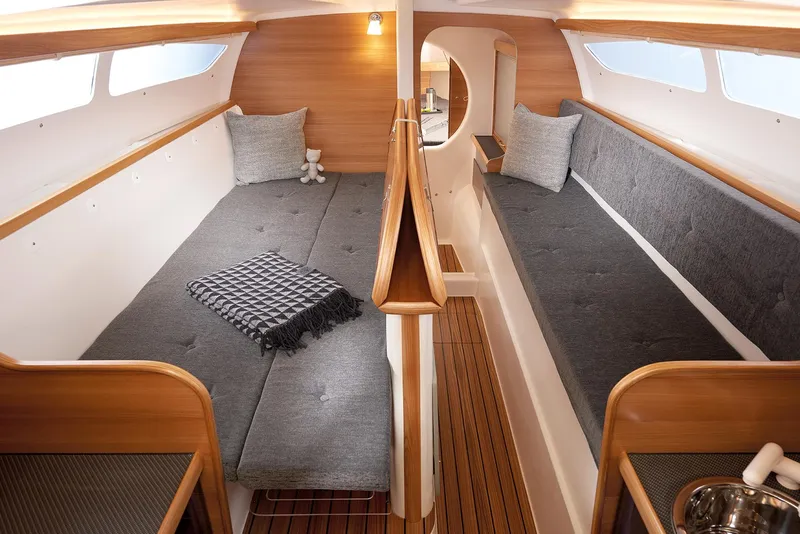 Slide: The Image of Cozy interior of 2026 Dragonfly 28 sailboat with twin gray cushioned benches. - 8