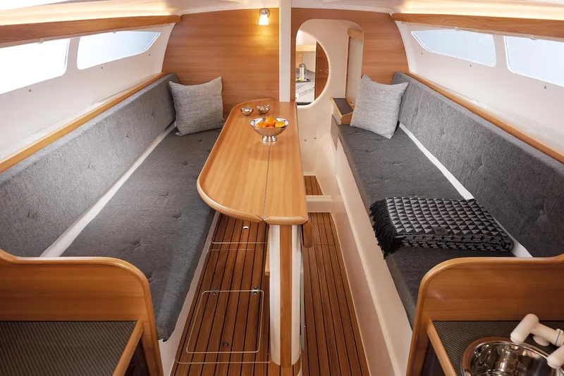 Slide: The Image of Interior of 2026 Dragonfly 28 sailboat with cozy seating and wooden finishes. - 9