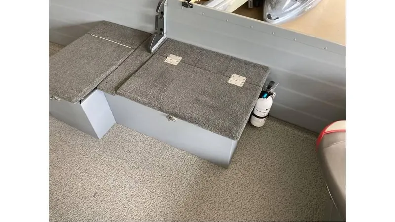 Slide: The Image of 2024 Smoker Craft Big Fisherman 16 interior storage compartments and fire extinguisher. - 3