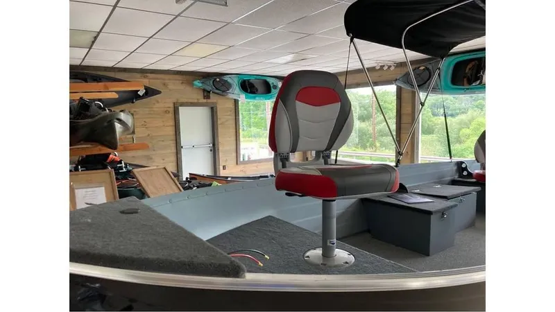 Slide: The Image of 2024 Smoker Craft Big Fisherman 16 boat interior with seating and storage. - 6