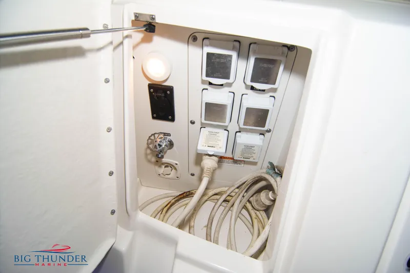 Slide: The Image of Electrical panel of 2016 Sea Ray 370 Sundancer boat with cables and switches. - 10