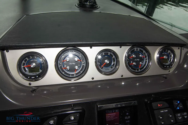 Slide: The Image of Dashboard of 2016 Sea Ray 370 Sundancer with gauges and controls. - 23