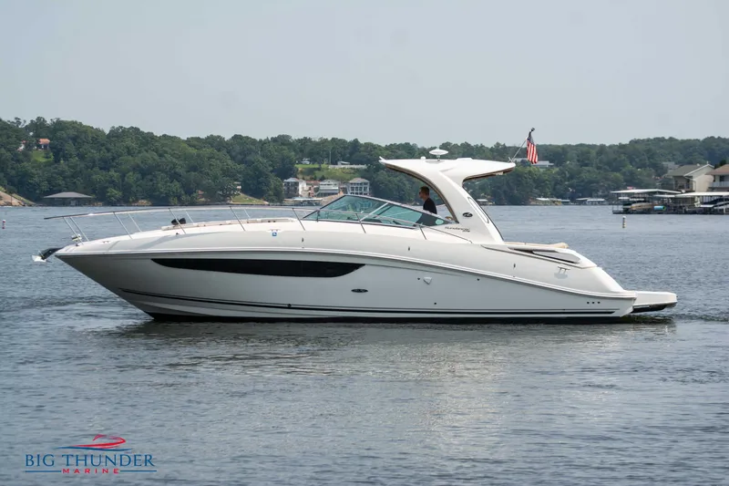 Slide: The Image of 2016 Sea Ray 370 Sundancer yacht on a serene lake, side view. - 3