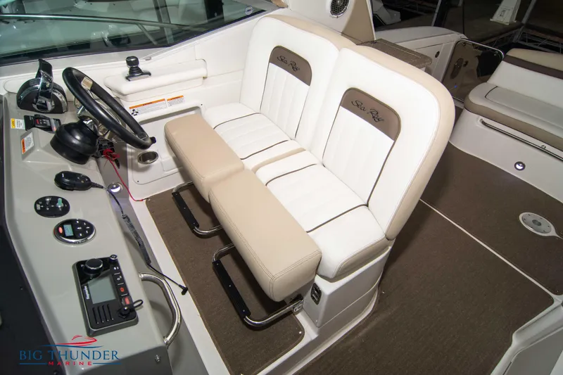 Slide: The Image of Interior helm of 2016 Sea Ray 370 Sundancer with dual seating and control panel. - 37