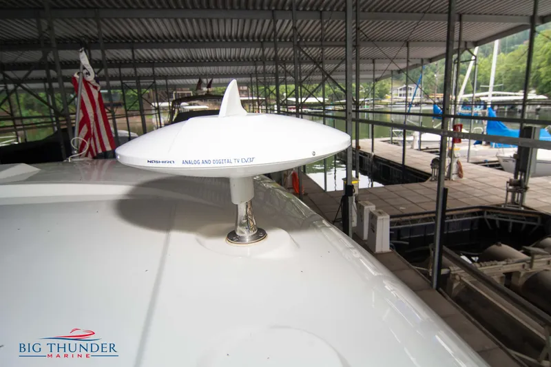 Slide: The Image of Sea Ray 370 Sundancer 2016 with satellite dish in marina. - 46