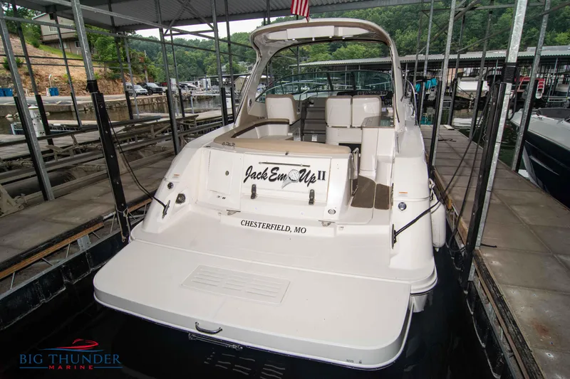 Slide: The Image of 2016 Sea Ray 370 Sundancer docked at marina, rear view. - 8