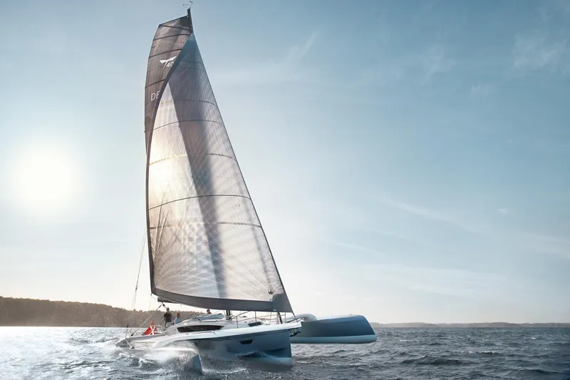 The Image of Sailing Dragonfly 40 trimaran on open sea, 2026 model, under clear blue sky. - 0
