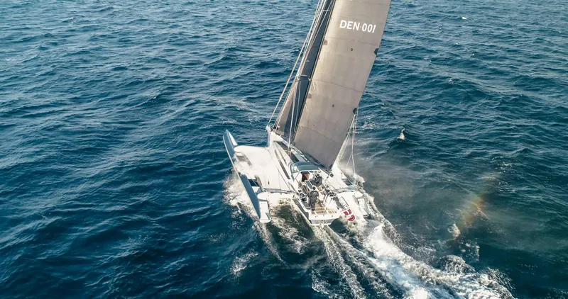 Slide: The Image of Aerial view of Dragonfly 40 sailboat navigating ocean waters, 2026 model. - 4
