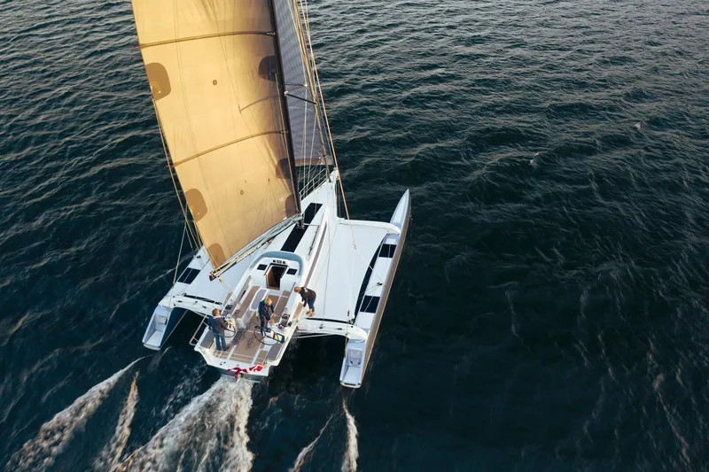 Slide: The Image of Aerial view of 2026 Dragonfly 40 sailboat gliding on open water. - 5