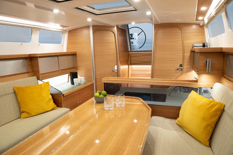 Slide: The Image of Luxurious interior of 2026 Dragonfly 40 yacht with modern wood finish and cozy seating. - 8