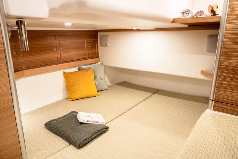 Slide: The Image of Cozy cabin interior of 2026 Dragonfly 40 yacht with cushions and wooden accents. - 9