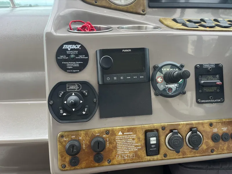Slide: The Image of Control panel of a 2006 Rinker 390 Express Cruiser boat. - 12