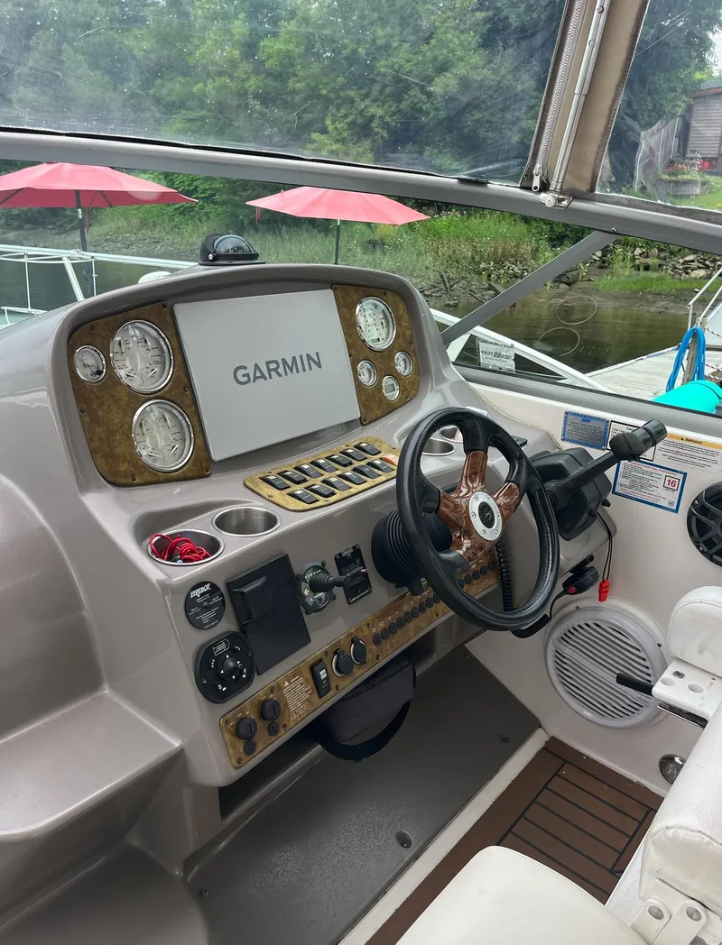 Slide: The Image of Helm of 2006 Rinker 390 Express Cruiser with Garmin navigation system. - 8