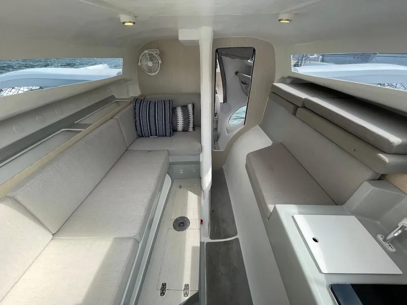 Slide: The Image of Interior of 2025 Corsair 880 sailboat, featuring modern seating and sleek design. - 10