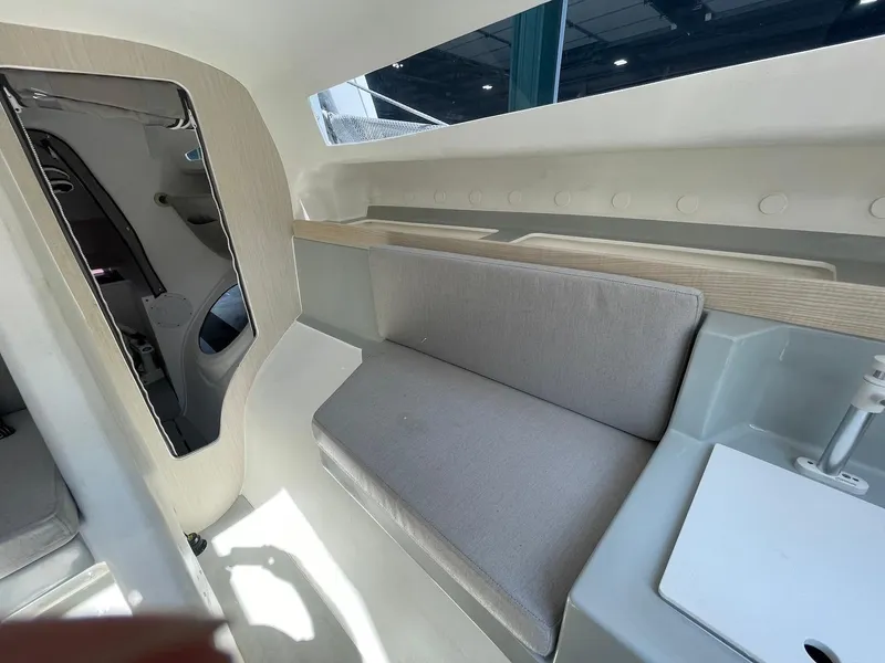 Slide: The Image of Interior of 2025 Corsair 880 sailboat, featuring modern seating and sleek design. - 11