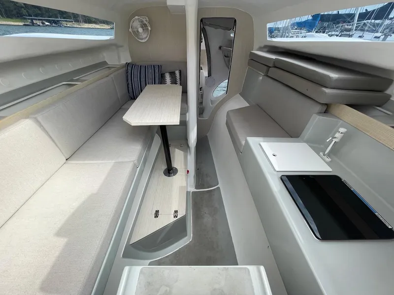 Slide: The Image of Modern interior of 2025 Corsair 880 sailboat with seating and table. - 9