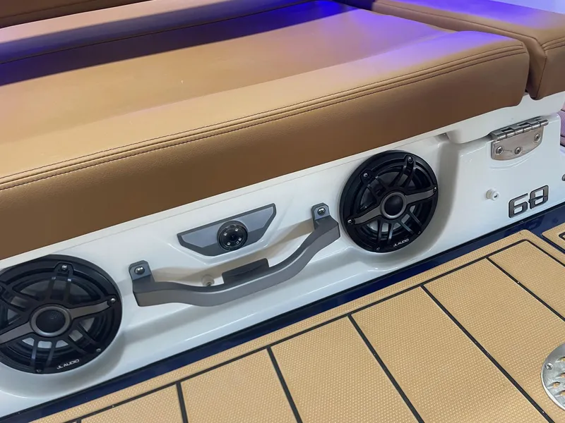 Slide: The Image of Chaparral 267 SSX 2025 boat interior with speakers and cushioned seating. - 20