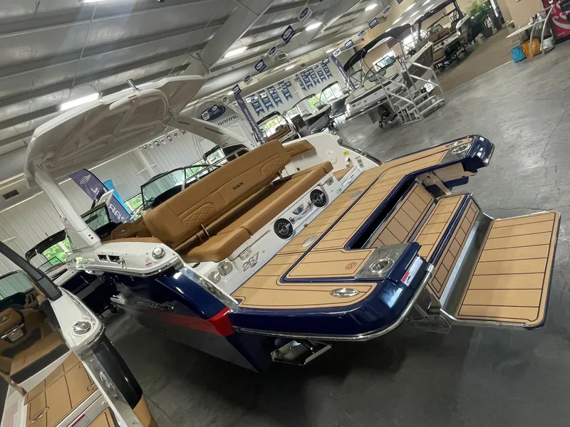 Slide: The Image of 2025 Chaparral 267 SSX boat with extended swim platform in showroom. - 5