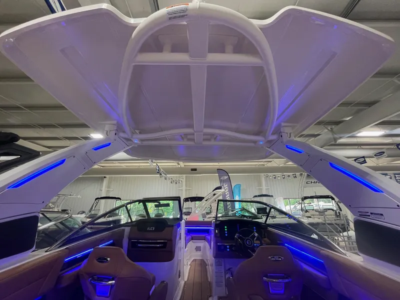 Slide: The Image of 2025 Chaparral 267 SSX boat interior with illuminated blue LED lights. - 9