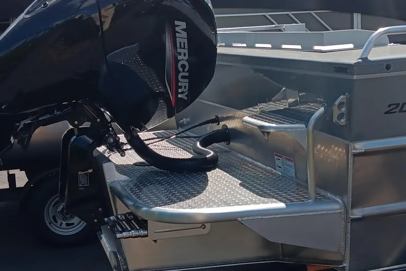 Slide: The Image of 2025 Spartan 200 Astoria boat with Mercury outboard motor, rear view. - 3