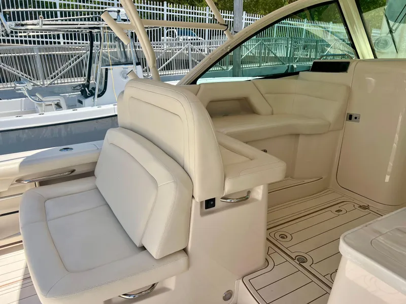 Slide: The Image of 2021 Grady-White Freedom 375 boat interior with white leather seating. - 12