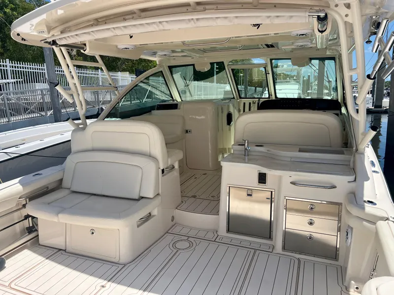 Slide: The Image of 2021 Grady-White Freedom 375 boat interior with white seating and stainless steel fixtures. - 13
