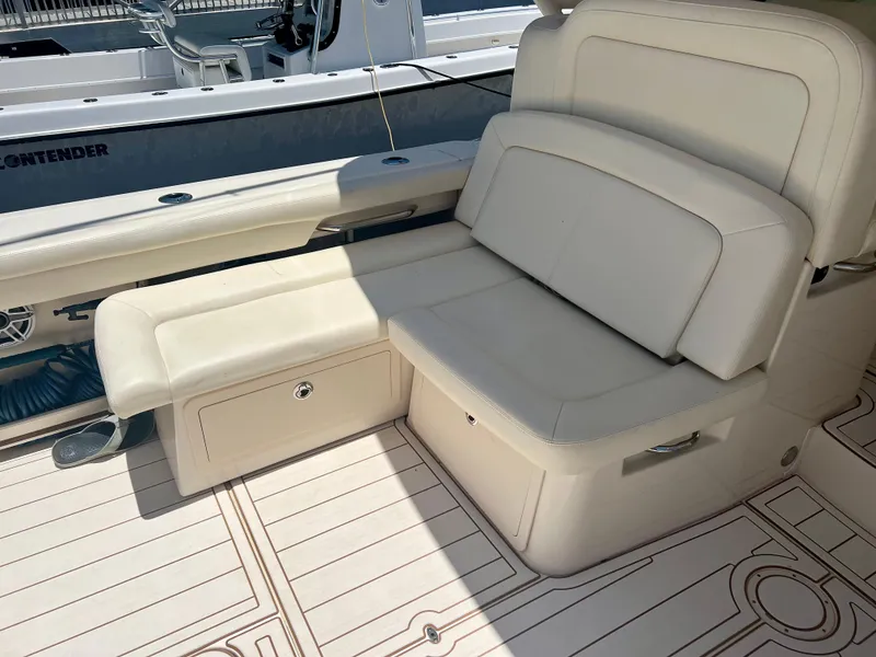 Slide: The Image of Grady-White Freedom 375 2021 boat interior with cushioned seating and storage. - 14