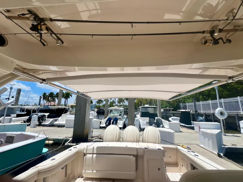 Slide: The Image of 2021 Grady-White Freedom 375 boat with retractable sunshade at marina. - 22