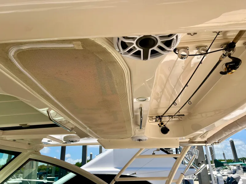 Slide: The Image of 2021 Grady-White Freedom 375 boat interior ceiling with fishing rod holders and speaker. - 29